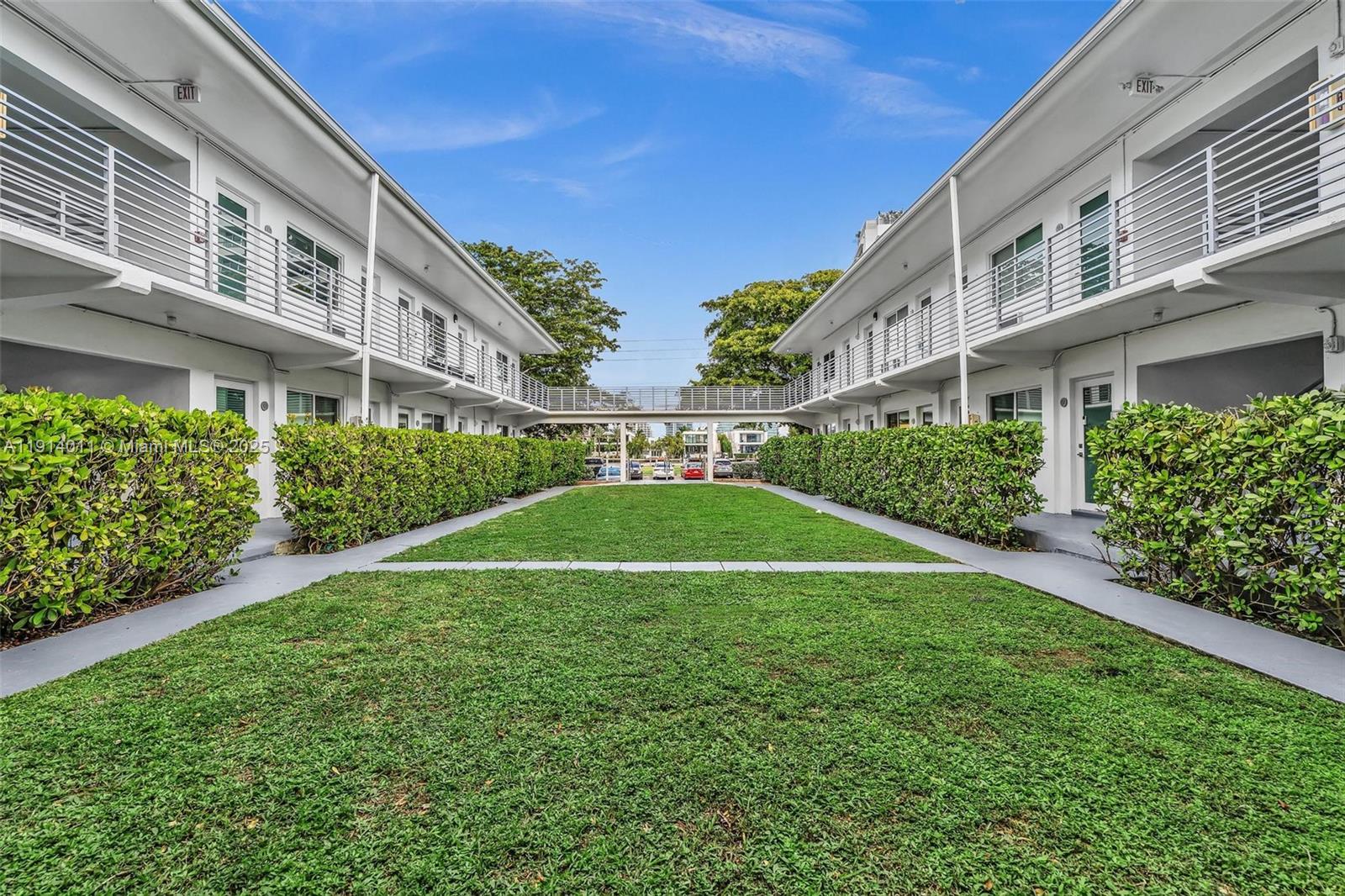 9200 East Bay Harbor Drive, Unit 2A Bay Harbor Islands, FL 33154 - Photo 41 of 45 a view of a building with a yard