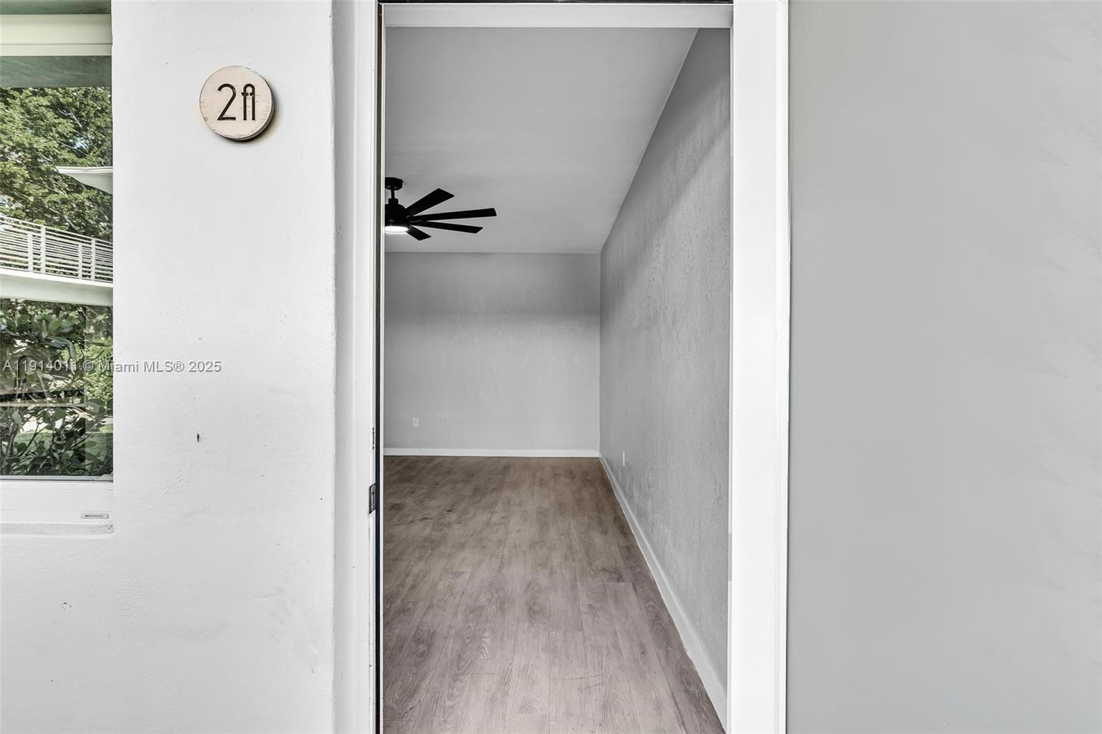 9200 East Bay Harbor Drive, Unit 2A Bay Harbor Islands, FL 33154 - Photo 7 of 45 a view of a hallway with wooden floor