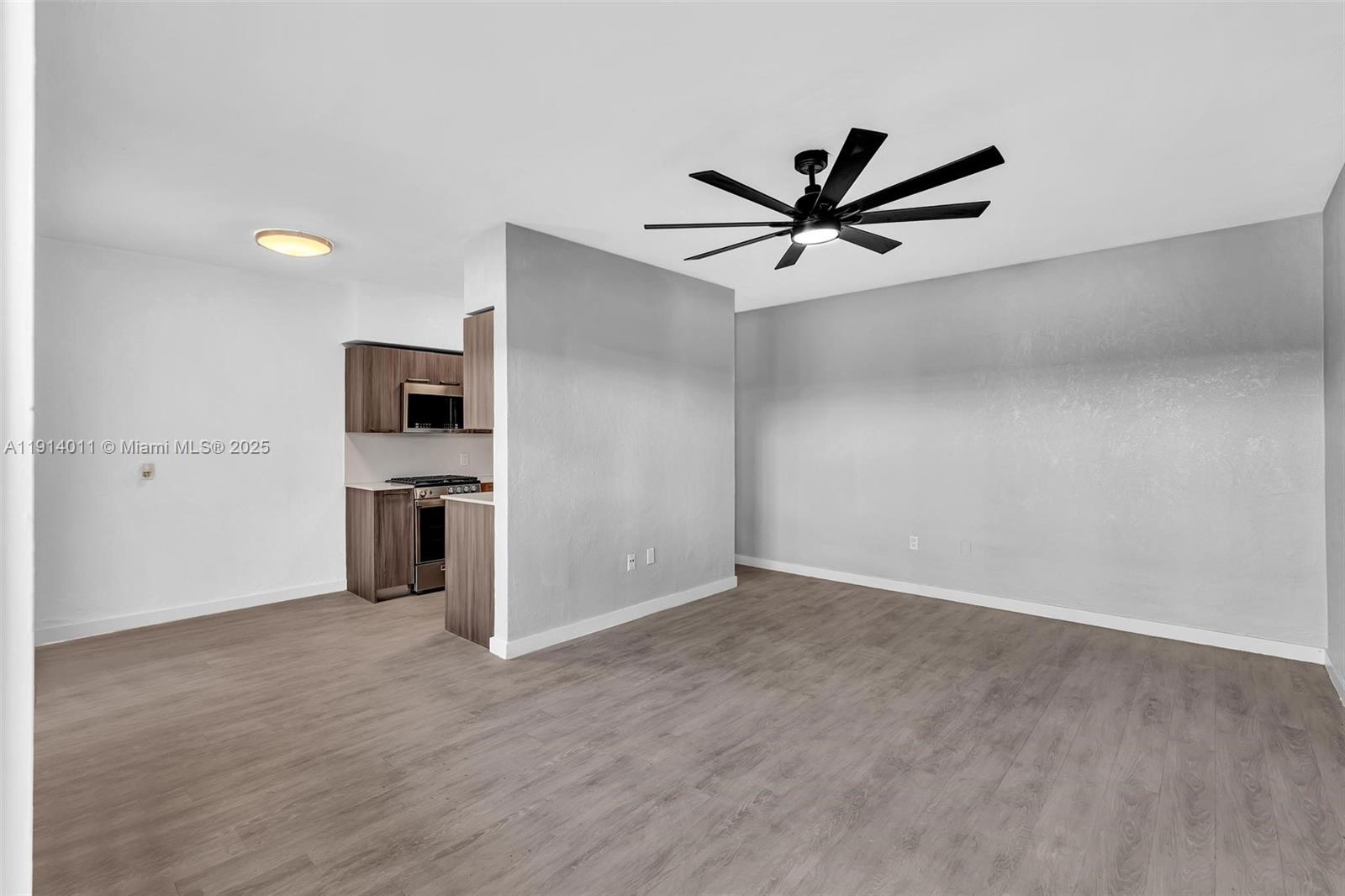 9200 East Bay Harbor Drive, Unit 2A Bay Harbor Islands, FL 33154 - Photo 8 of 45 a view of a kitchen with a sink and a stove top oven