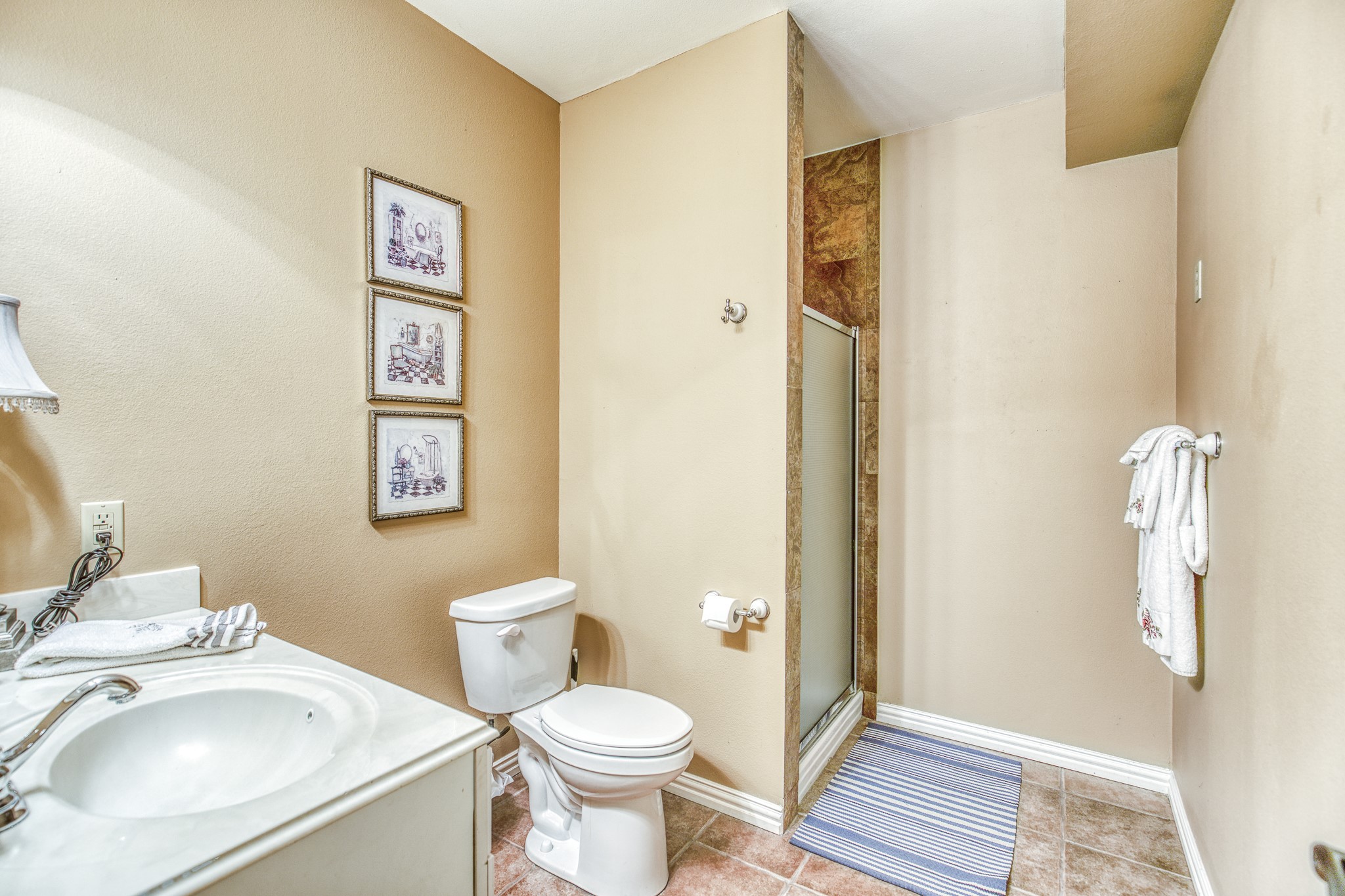 533 Bybee Road Round Top, TX 78954 - Photo 12 of 29 a bathroom with a toilet sink and a mirror