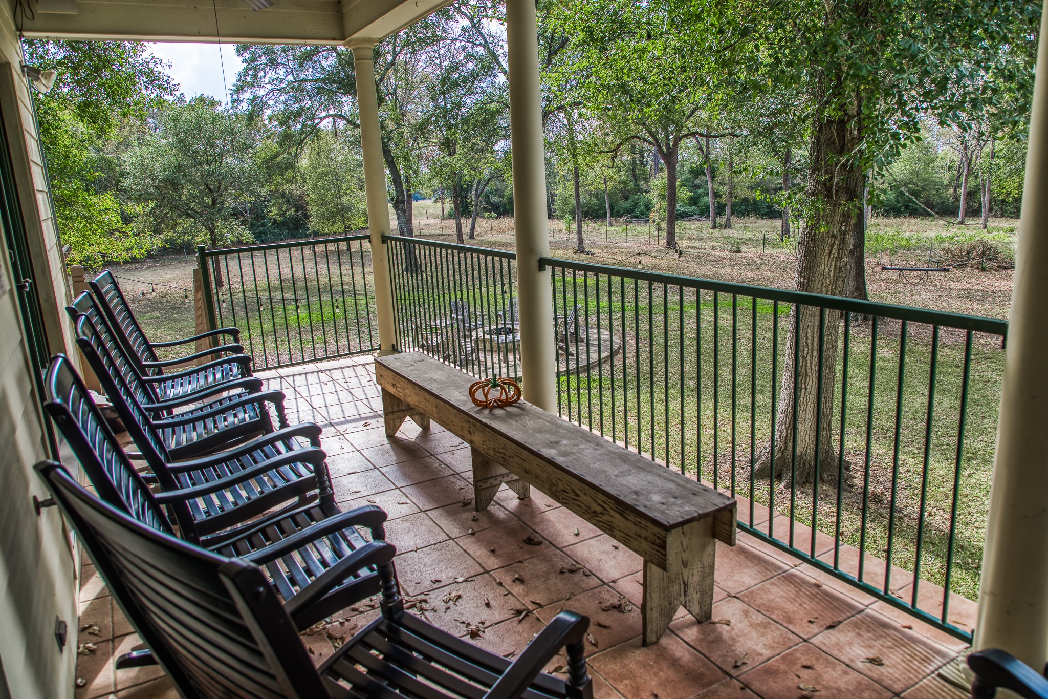 533 Bybee Road Round Top, TX 78954 - Photo 16 of 29 a view of a balcony with wooden floor