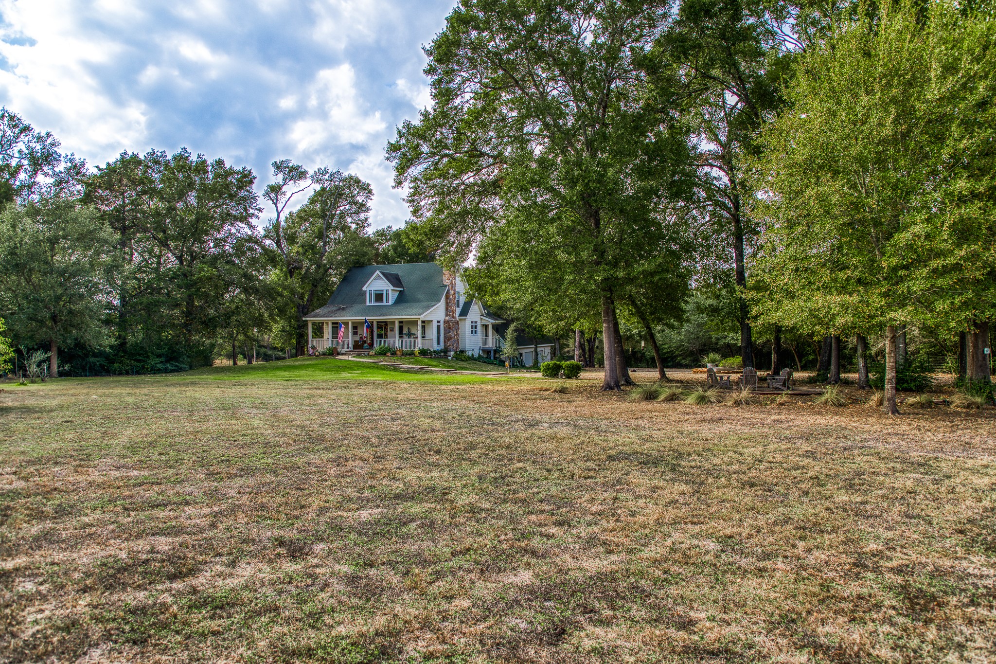 533 Bybee Road Round Top, TX 78954 - Photo 26 of 29 a view of a house with yard and sitting area