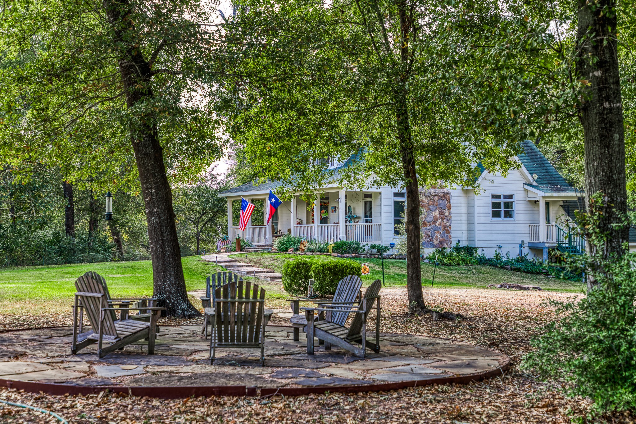 533 Bybee Road Round Top, TX 78954 - Photo 27 of 29 a view of a house with backyard and sitting area