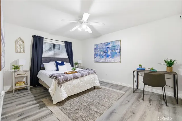 a bedroom with a bed and a table