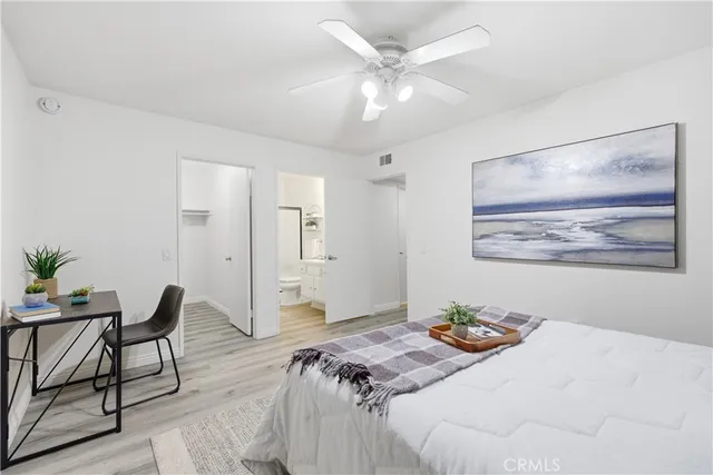 a bedroom with a bed and chair