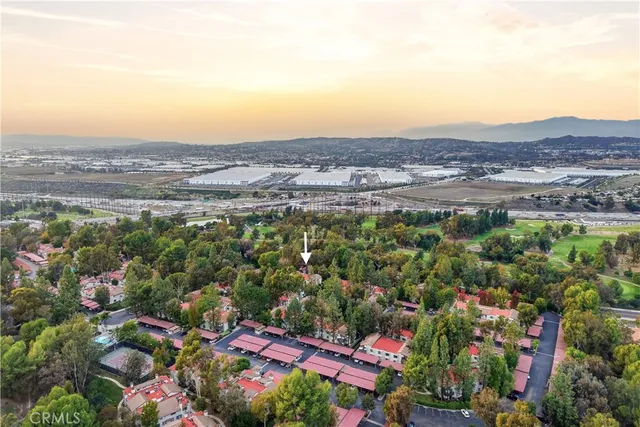 an aerial view of residential house and sandy dunes