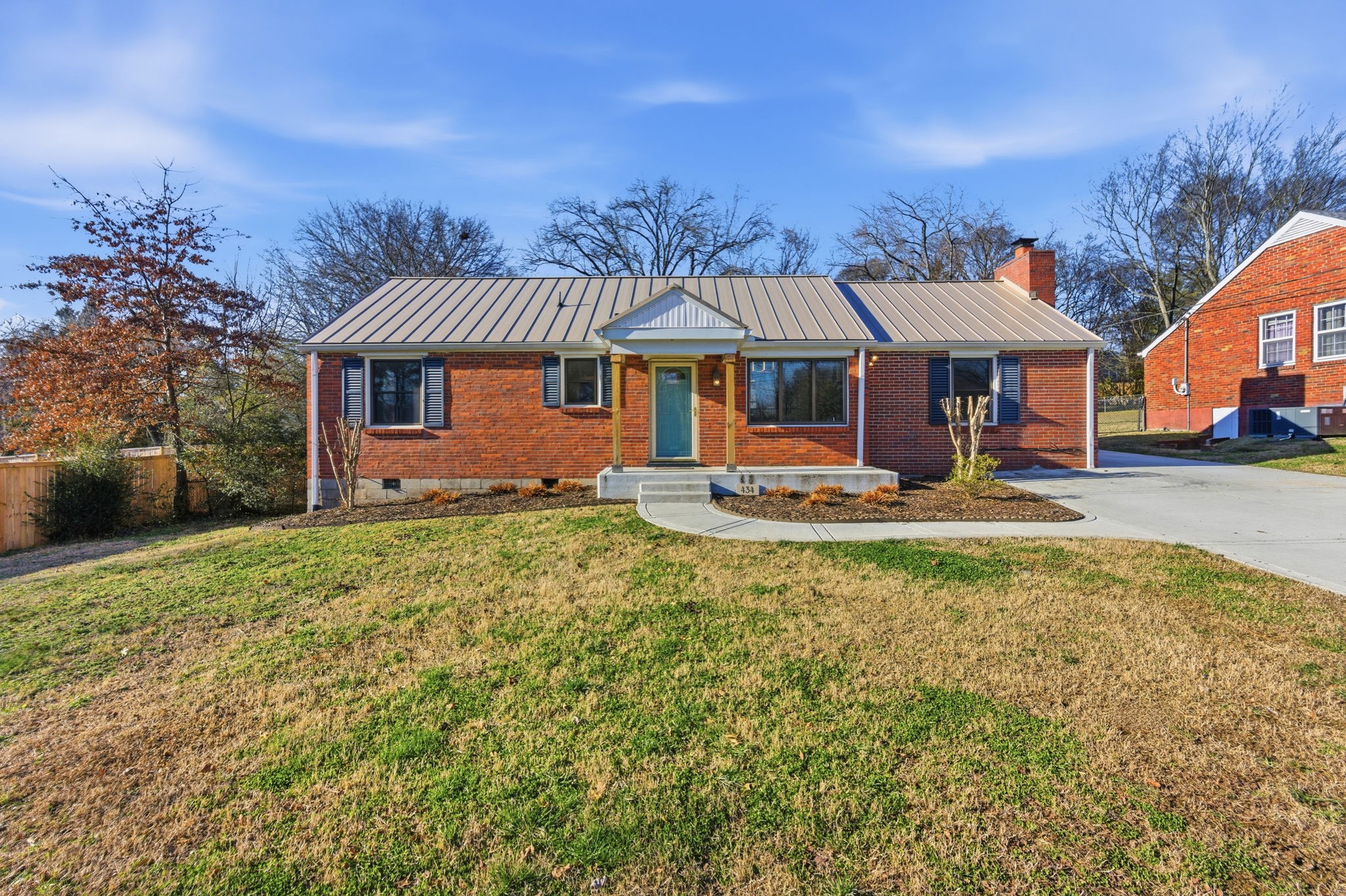 434 Adair Road Nashville, TN 37214 - Photo 1 of 25 a front view of a house with a yard table and chairs