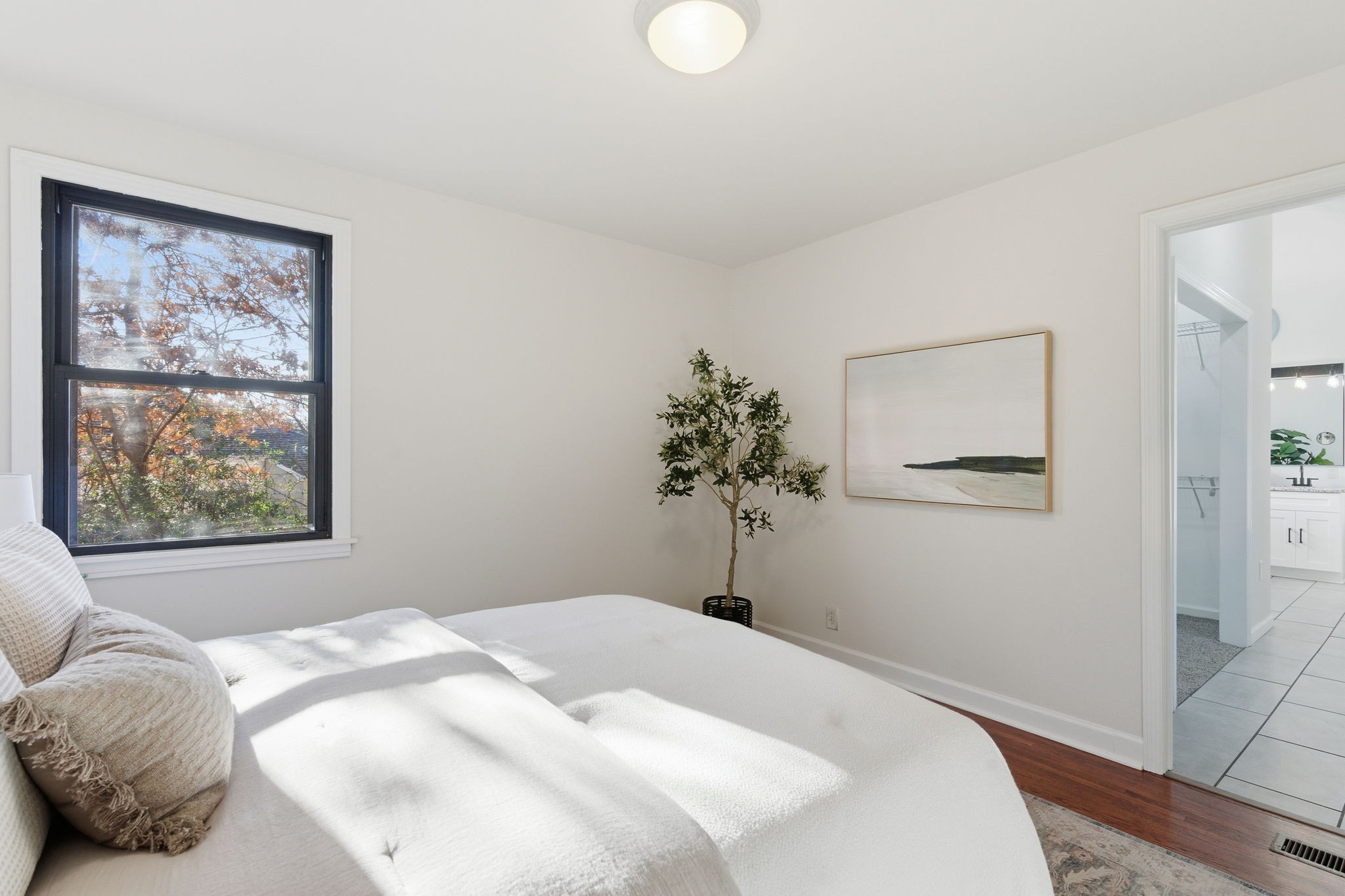 434 Adair Road Nashville, TN 37214 - Photo 14 of 25 a bedroom with a bed and a painting on the wall