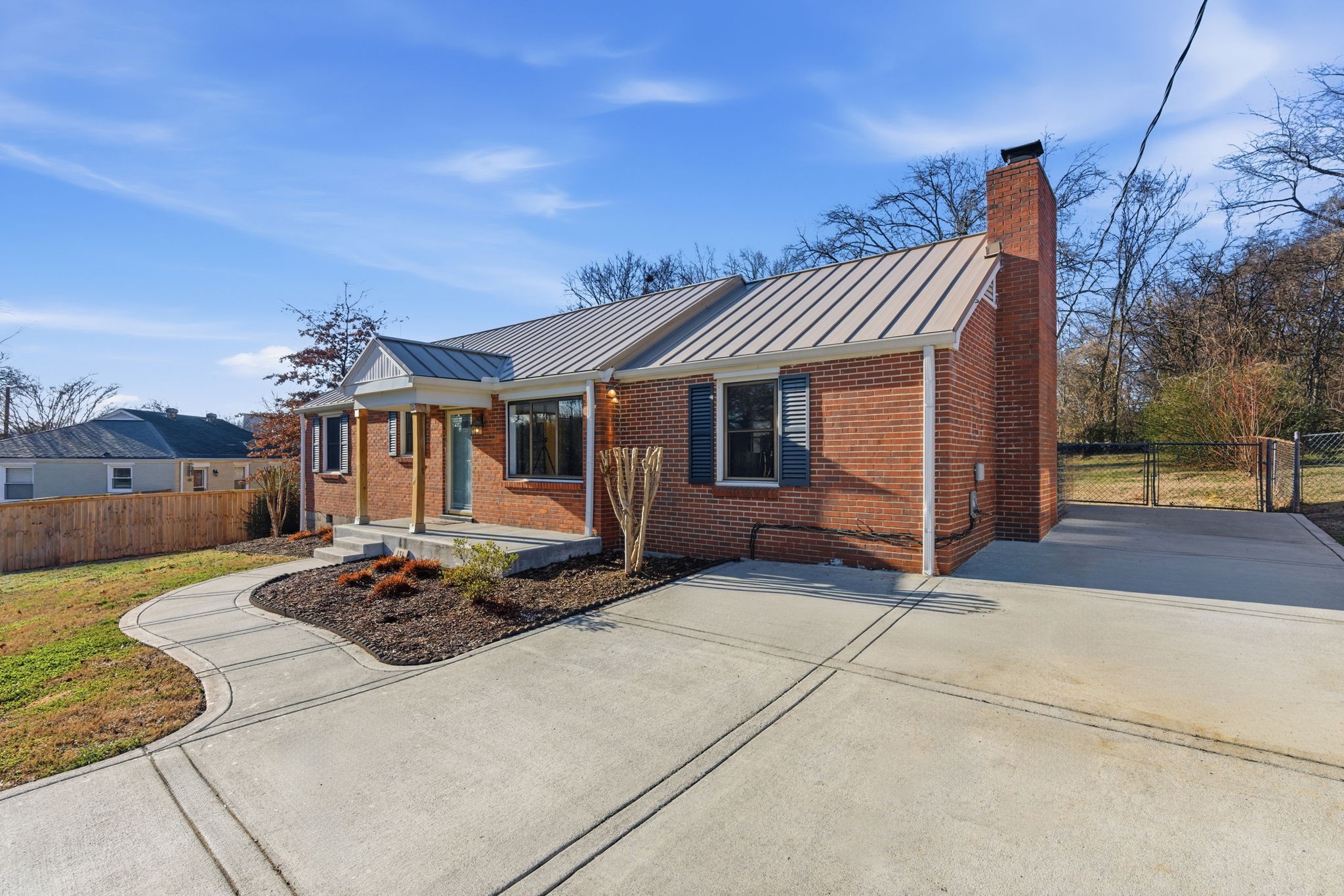 434 Adair Road Nashville, TN 37214 - Photo 2 of 25 a front view of a house with garden