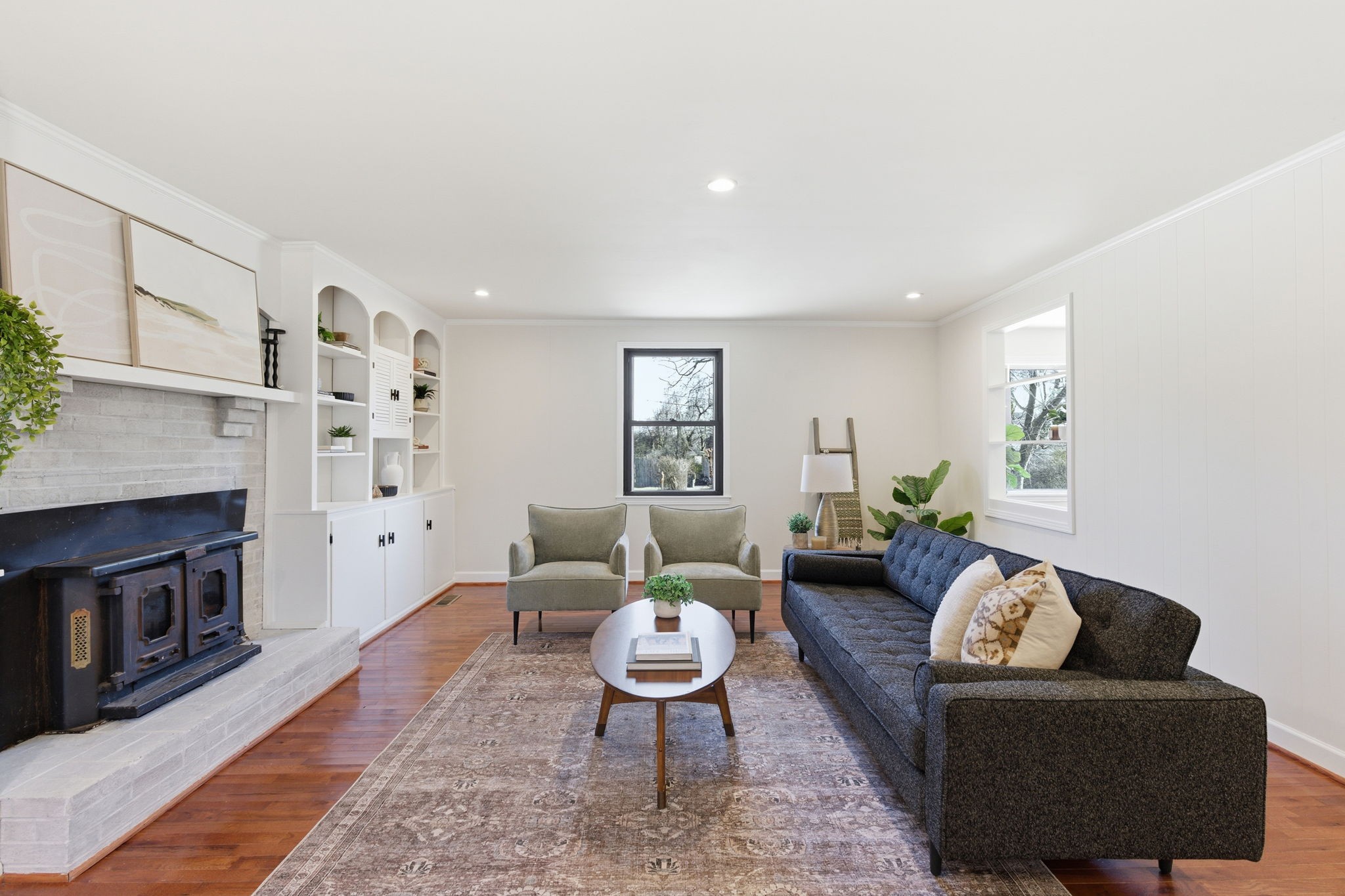 434 Adair Road Nashville, TN 37214 - Photo 4 of 25 a living room with furniture flat screen tv and a fireplace