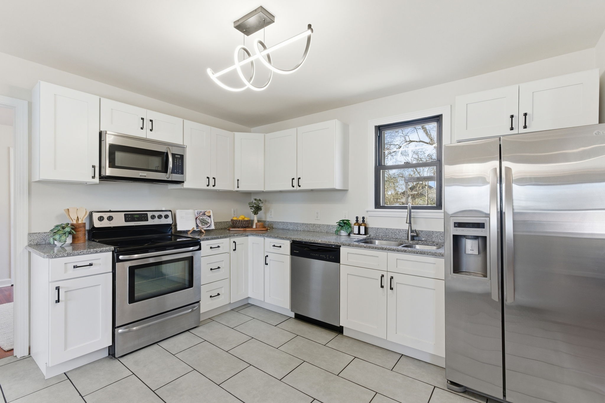 434 Adair Road Nashville, TN 37214 - Photo 10 of 25 a kitchen with white cabinets appliances and a sink