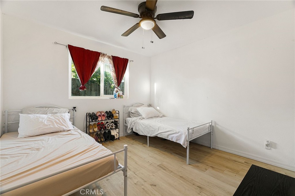 342 Rio Vista Court Corning, CA 96021 - Photo 16 of 28 a bedroom with a bed and wooden floor