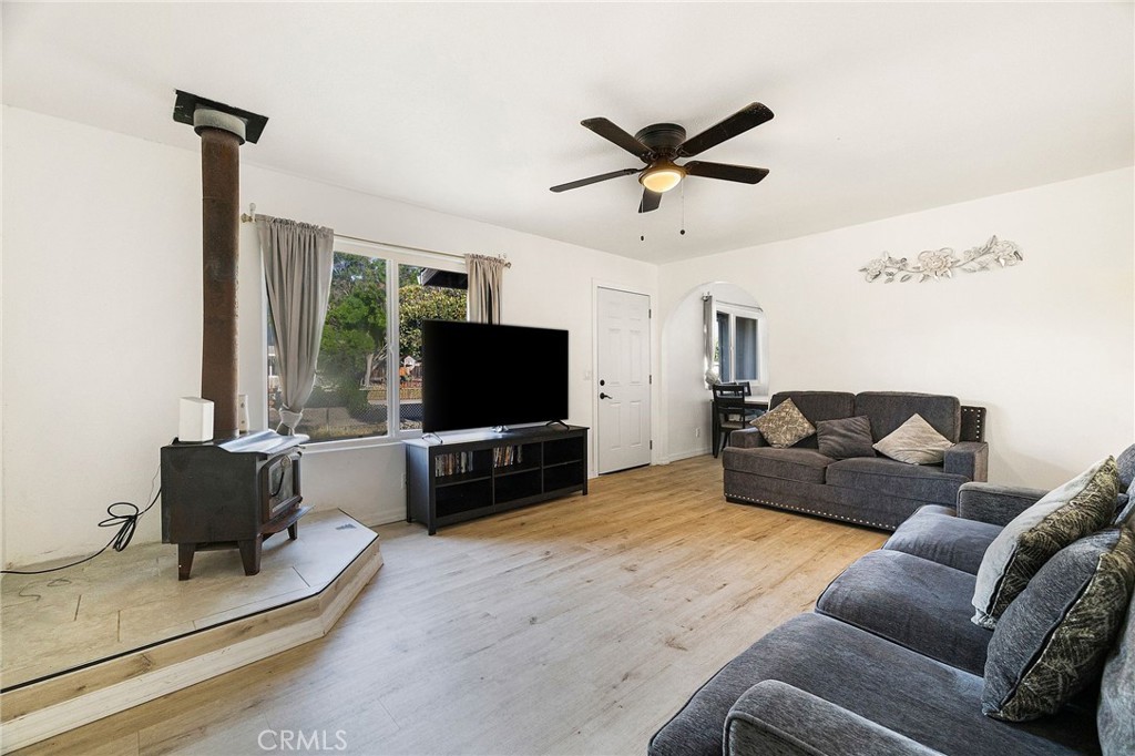 342 Rio Vista Court Corning, CA 96021 - Photo 6 of 28 a living room with furniture and a flat screen tv