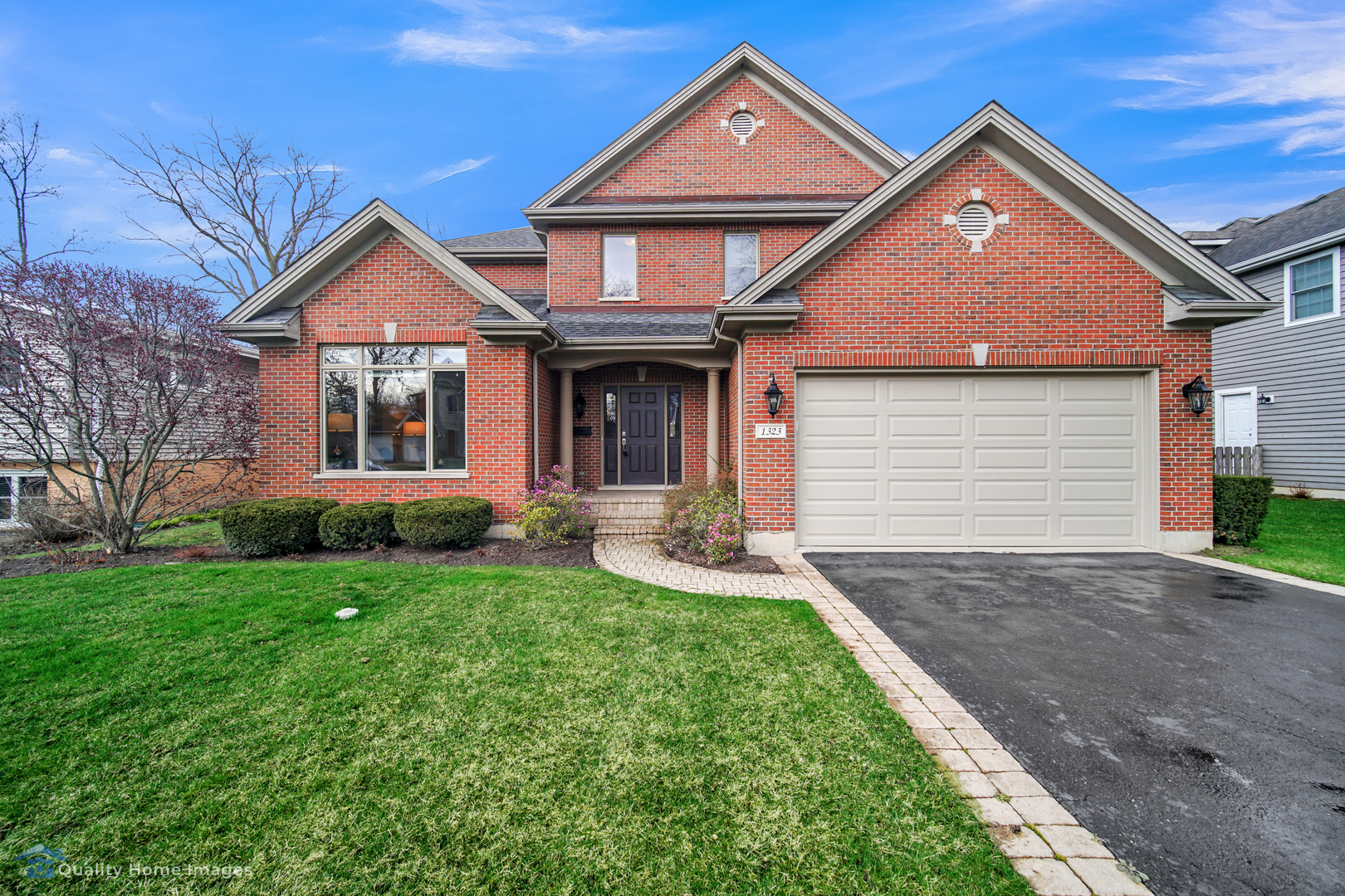 1323 Kenton Road Deerfield, IL 60015 - Photo 1 of 20 a front view of a house with yard and green space