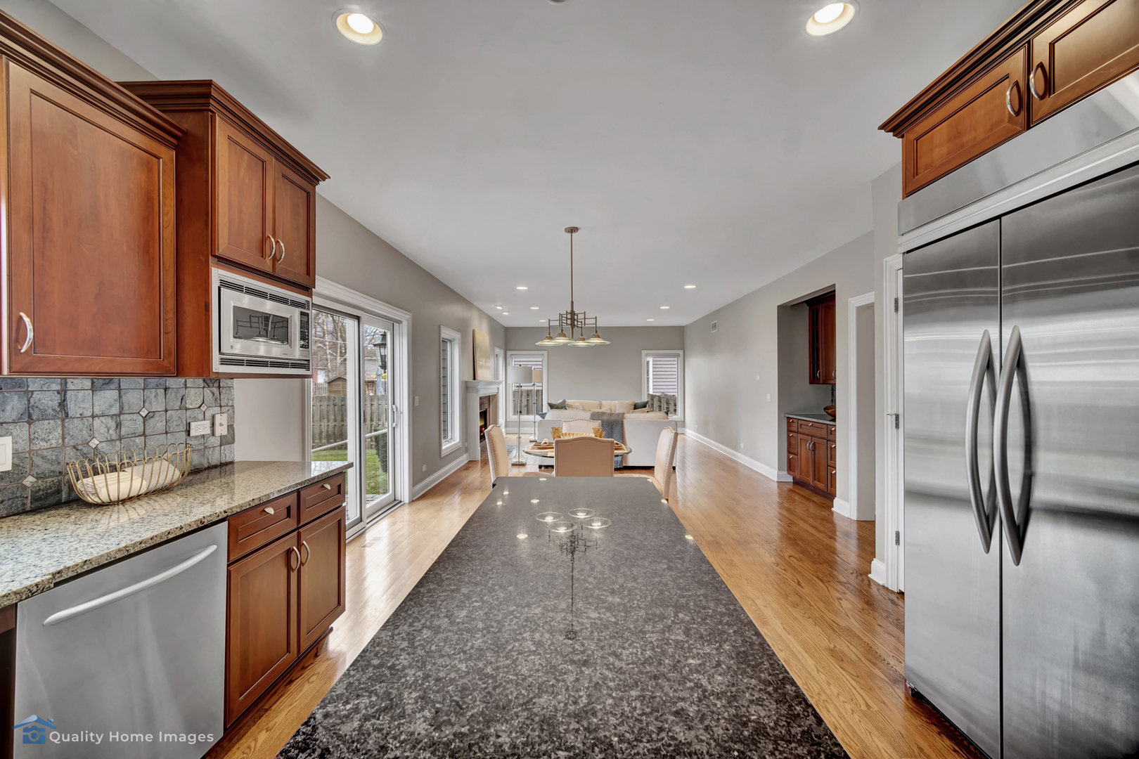 1323 Kenton Road Deerfield, IL 60015 - Photo 6 of 20 a large white kitchen with granite countertop a large counter top appliances and cabinets