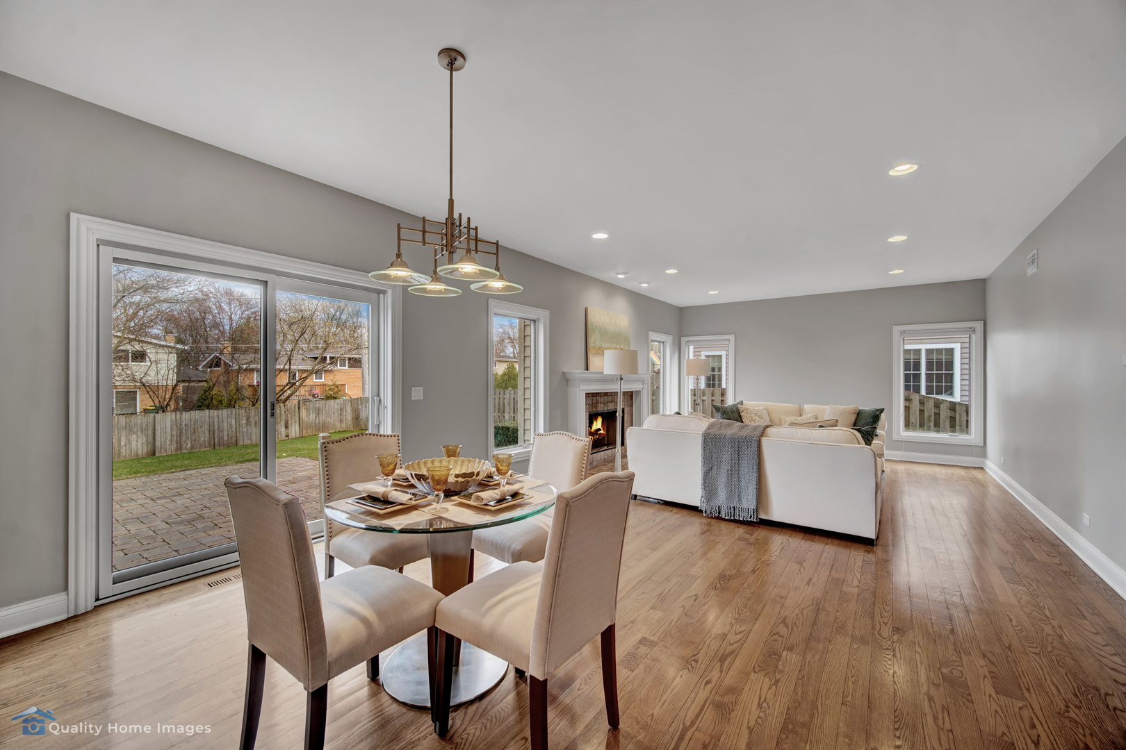 1323 Kenton Road Deerfield, IL 60015 - Photo 7 of 20 a dining room with furniture wooden floor and a chandelier