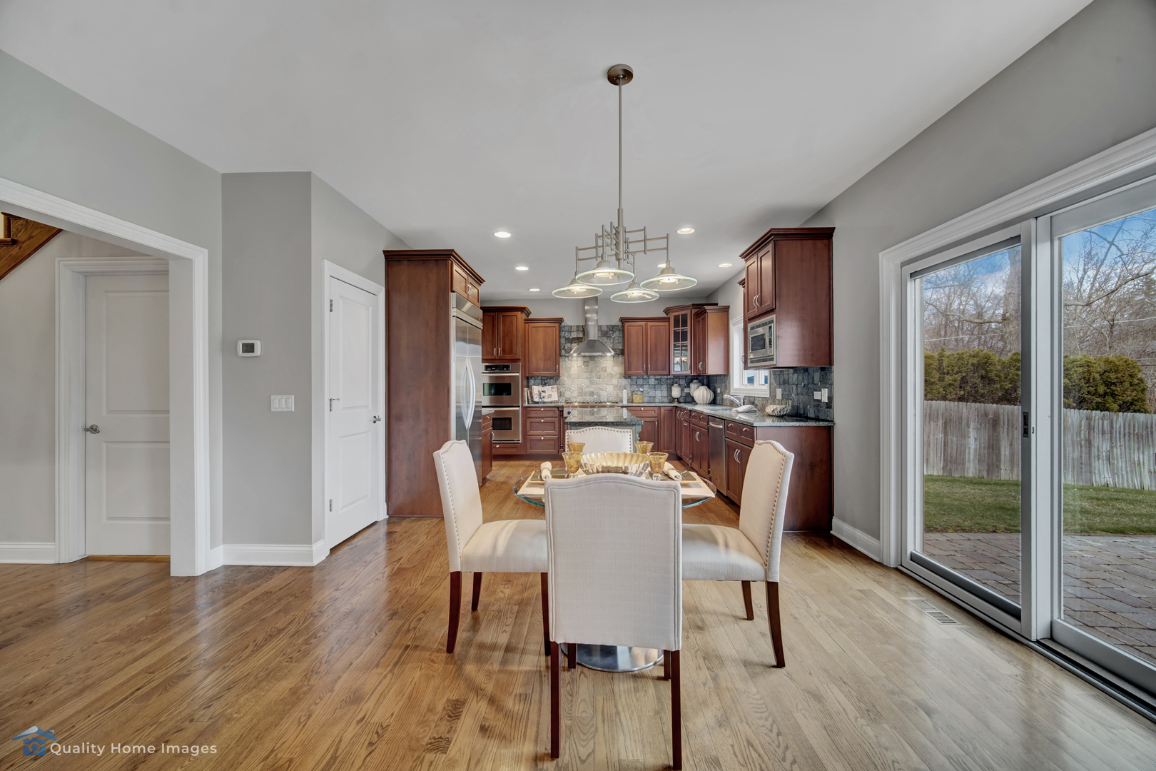1323 Kenton Road Deerfield, IL 60015 - Photo 8 of 20 a room with stainless steel appliances a dining table chairs and large windows