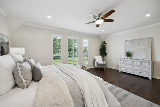 a bedroom with a large bed and a large window