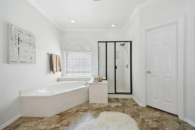 a bathroom with a tub toilet sink and mirror