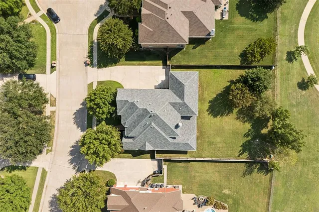 an aerial view of a house with swimming pool