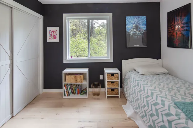 a bedroom with a bed and a cabinets