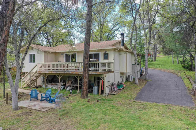 a view of a house with a yard porch and sitting area