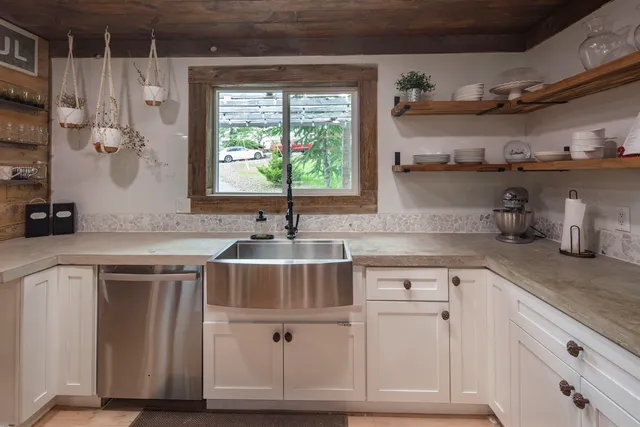 a kitchen with cabinets and window