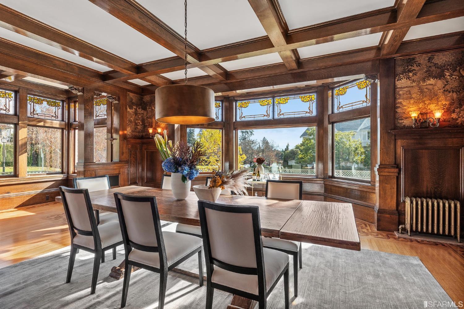2967 Avalon Avenue Berkeley, CA 94705 - Photo 14 of 77 a dining room with furniture a chandelier and wooden floor