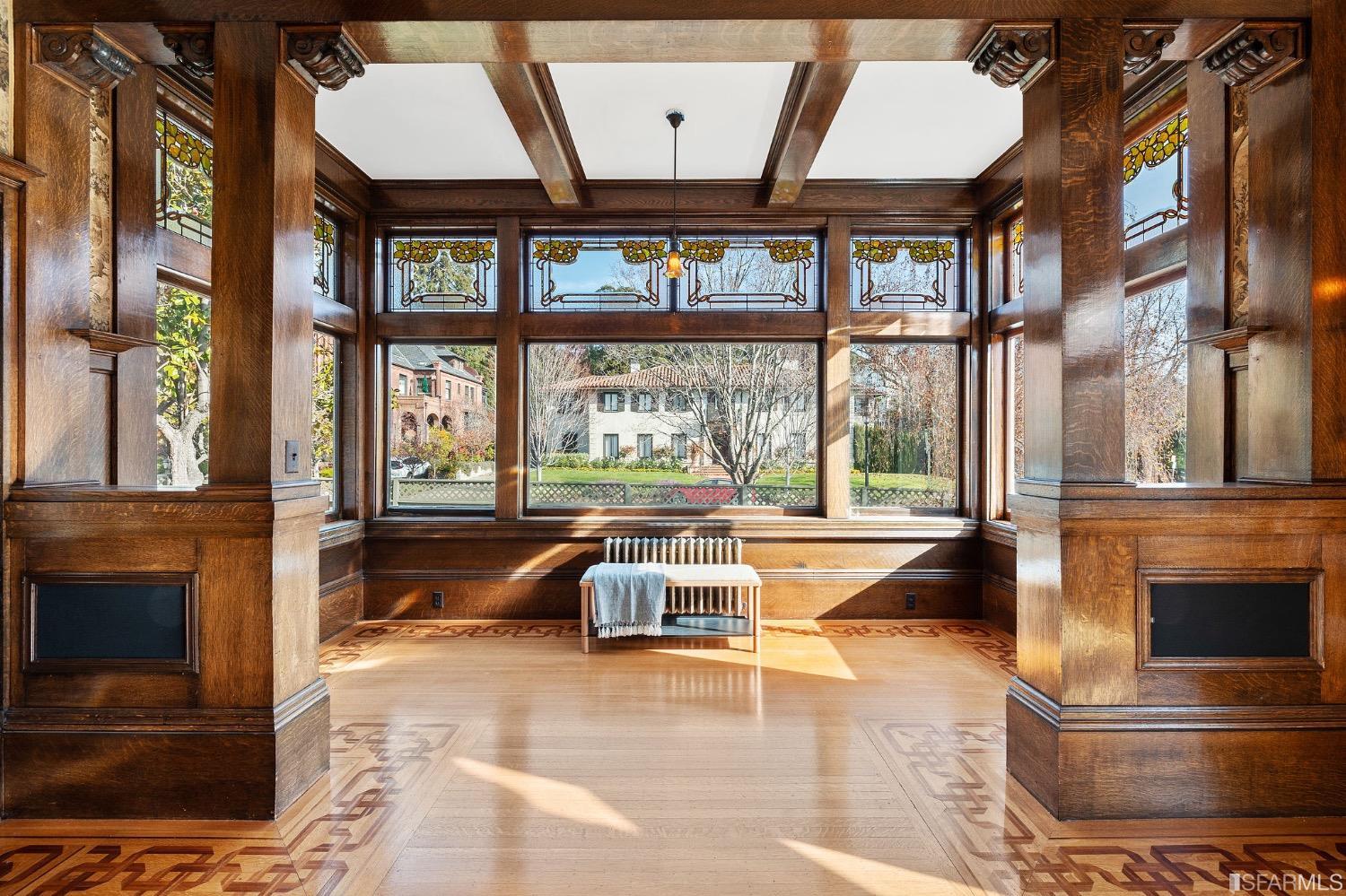2967 Avalon Avenue Berkeley, CA 94705 - Photo 18 of 77 a living room with large windows a rug and a chandelier