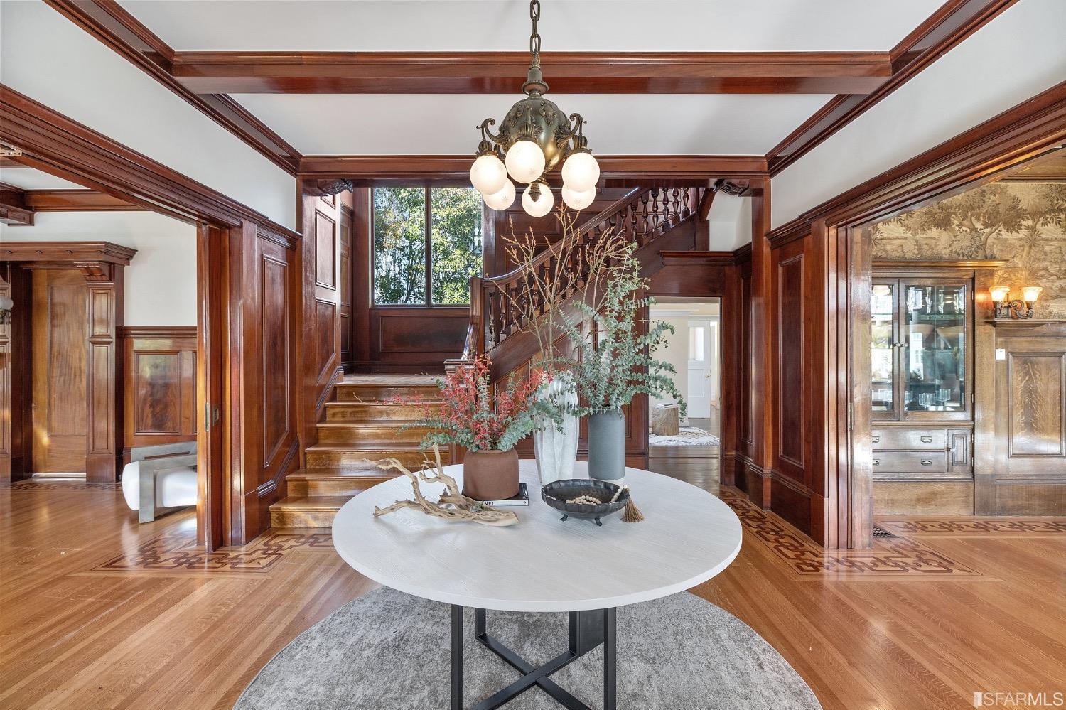 2967 Avalon Avenue Berkeley, CA 94705 - Photo 4 of 77 a dining room with wooden floor a chandelier a wooden table and chairs