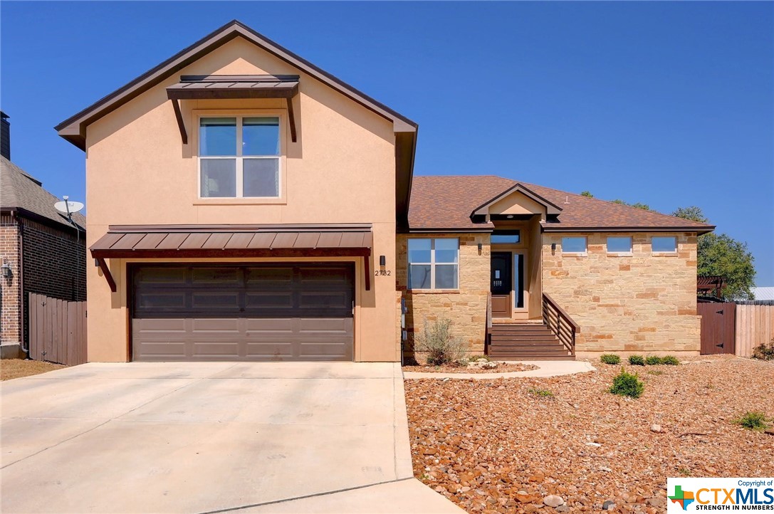 2732 Crest Ridge Drive New Braunfels, TX 78132 - Photo 1 of 1 a front view of a house with a yard