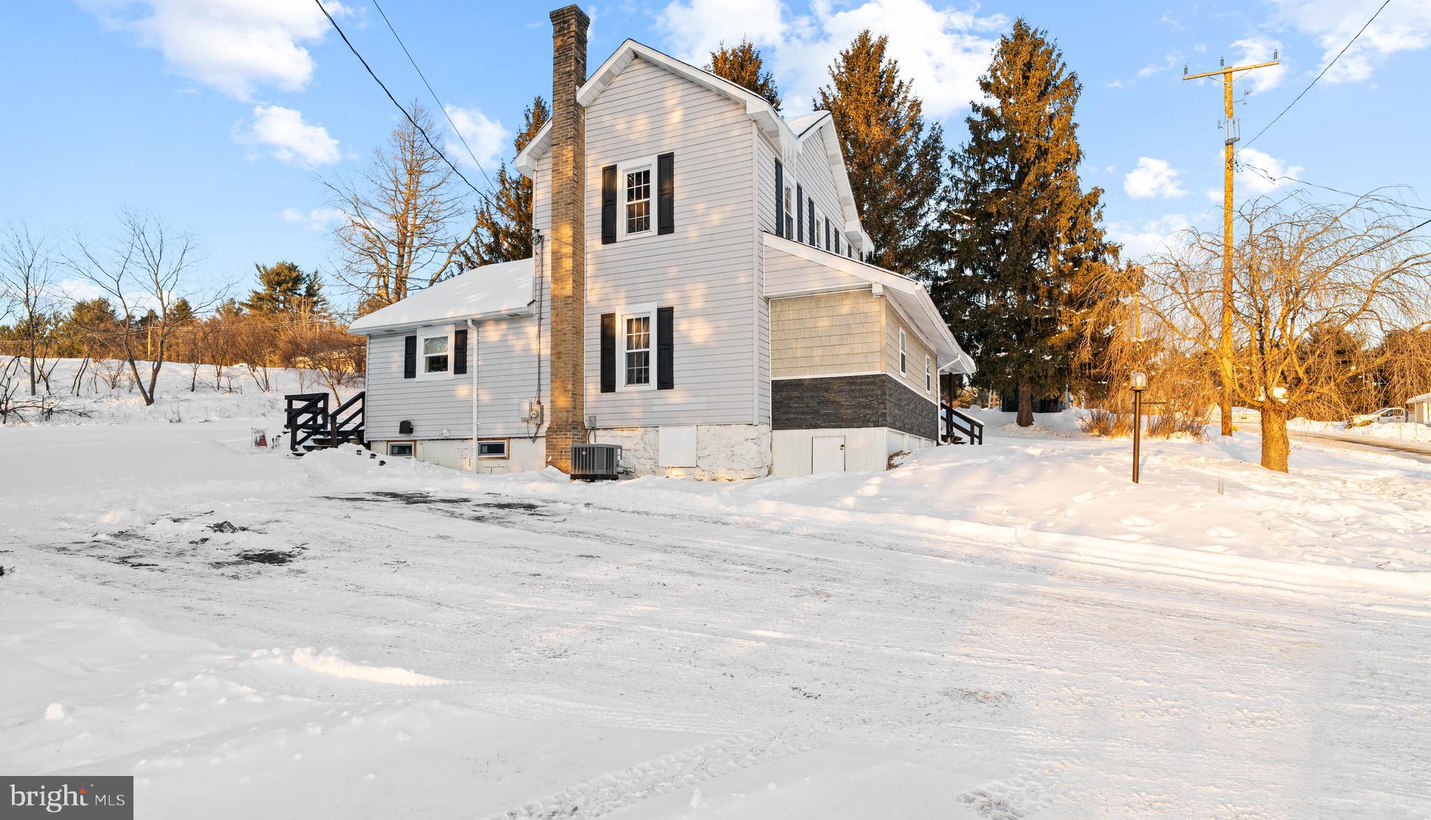 197 Ridge Street Smokerun, PA 16681 - Photo 45 of 47 a view of a white house with snow on the road