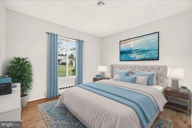 a bedroom with bed and a window