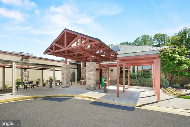 a view of a building with a backyard and balcony