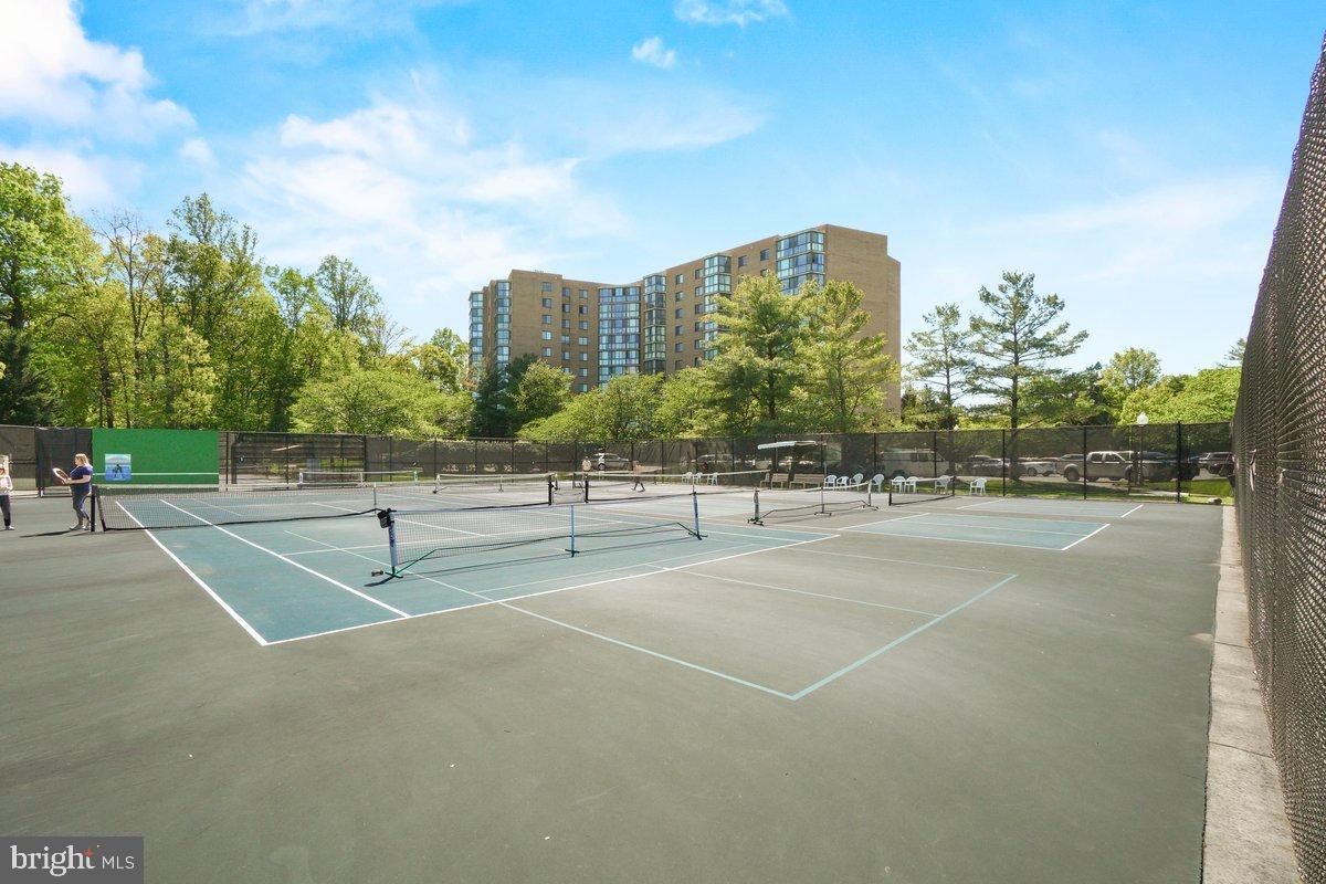 9 Fitzhugh Court, Unit 71B Silver Spring, MD 20906 - Photo 45 of 48 Sunny tennis courts surrounded by greenery.