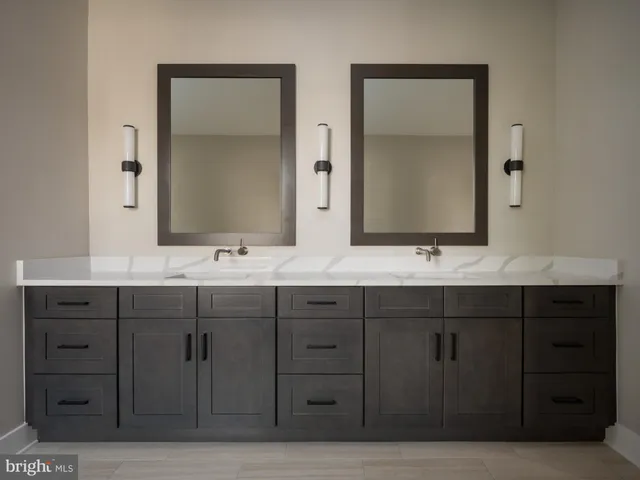 a bathroom with double sink and a mirror