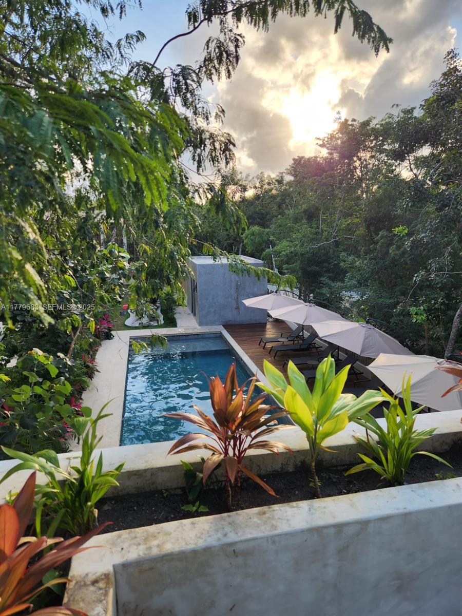 77760 Itzamna, Unit D101 undefined, FL 00000 - Photo 12 of 35 an outdoor space with furniture