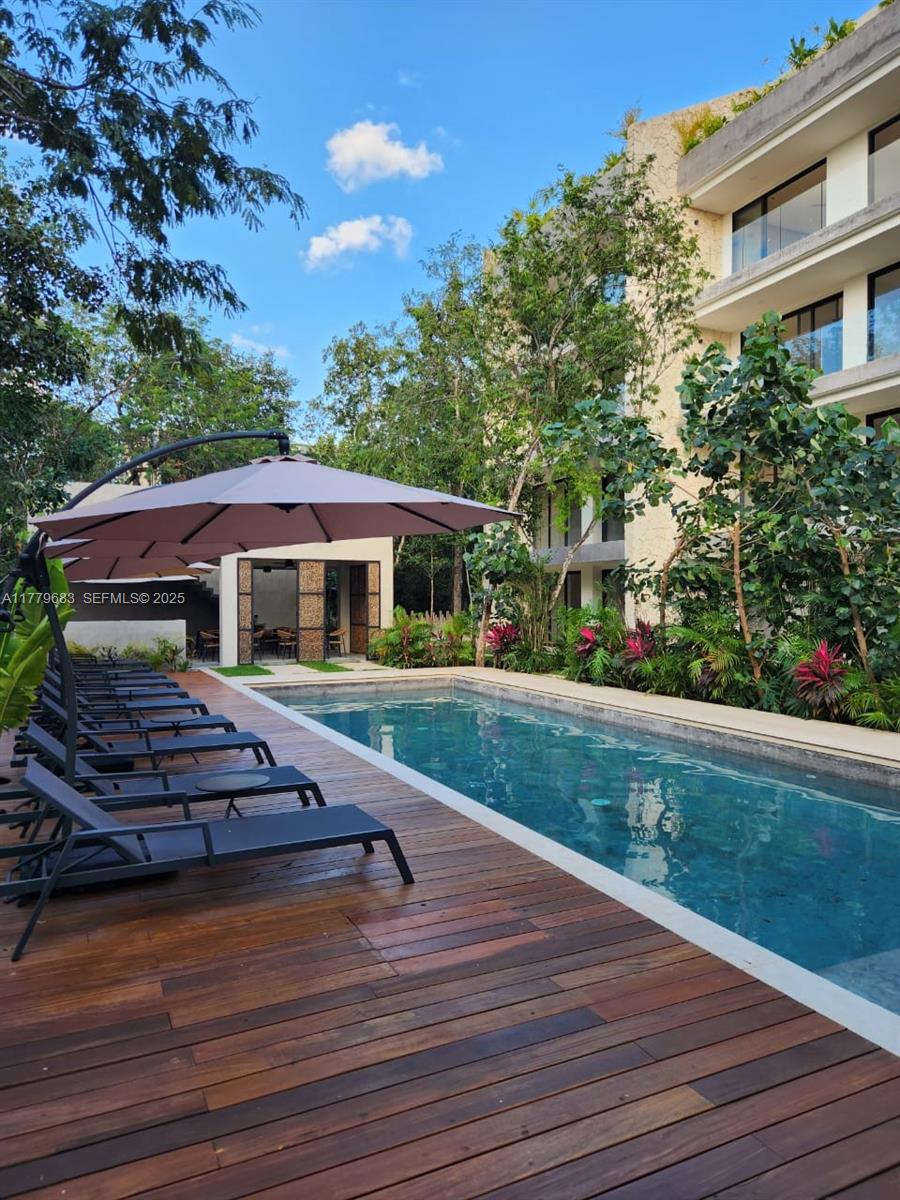 77760 Itzamna, Unit D101 undefined, FL 00000 - Photo 13 of 35 a front view of a house with a yard