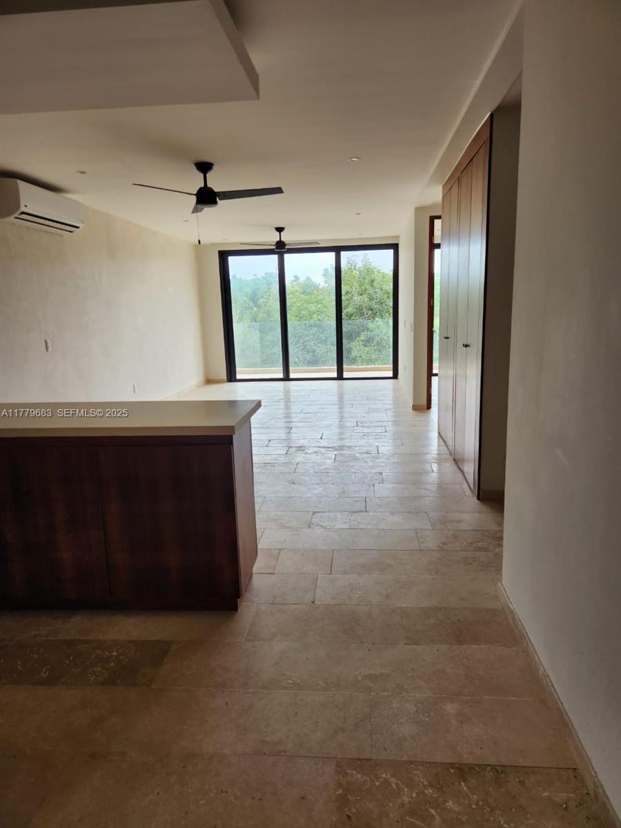 77760 Itzamna, Unit D101 undefined, FL 00000 - Photo 19 of 35 a view of an empty room with a window