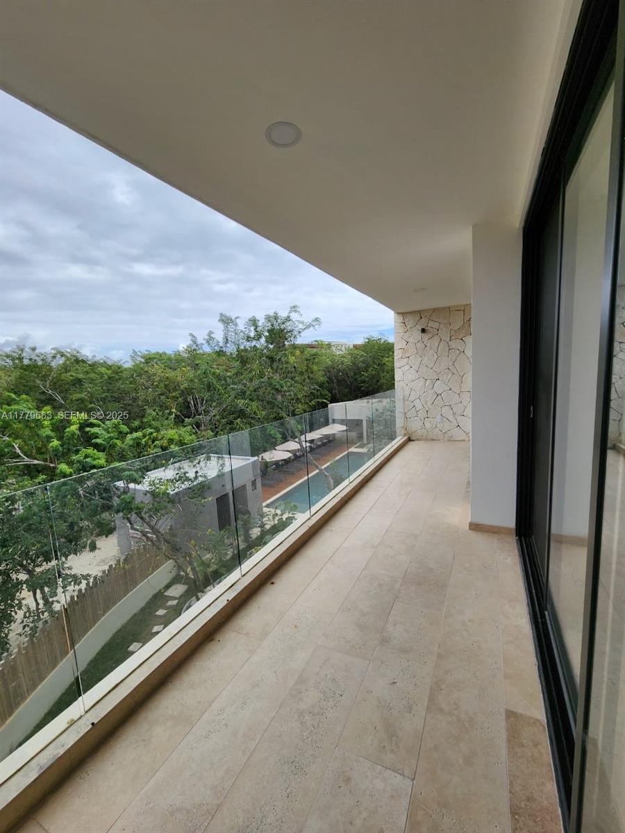 77760 Itzamna, Unit D101 undefined, FL 00000 - Photo 21 of 35 a view of balcony with outdoor space