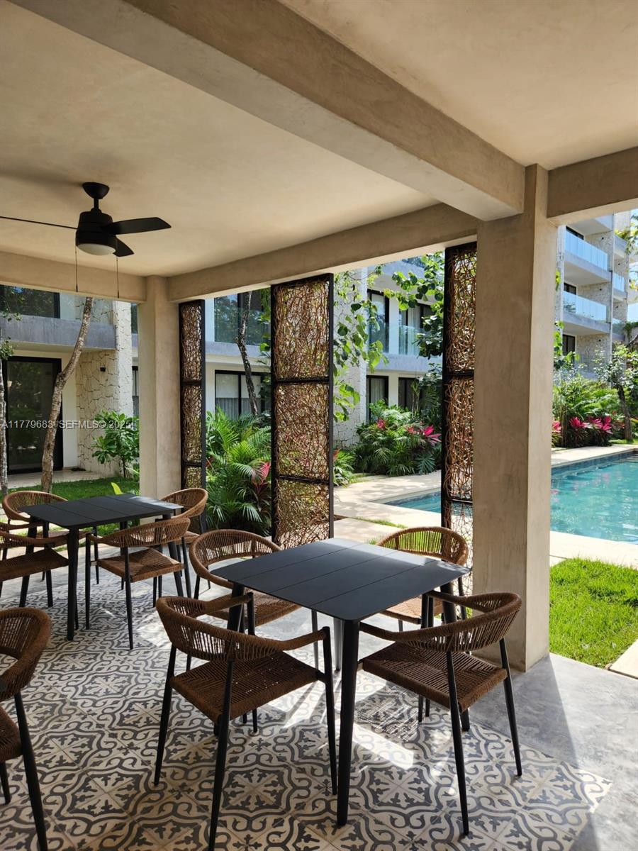77760 Itzamna, Unit D101 undefined, FL 00000 - Photo 28 of 35 a view of a dining room with furniture window and outside view