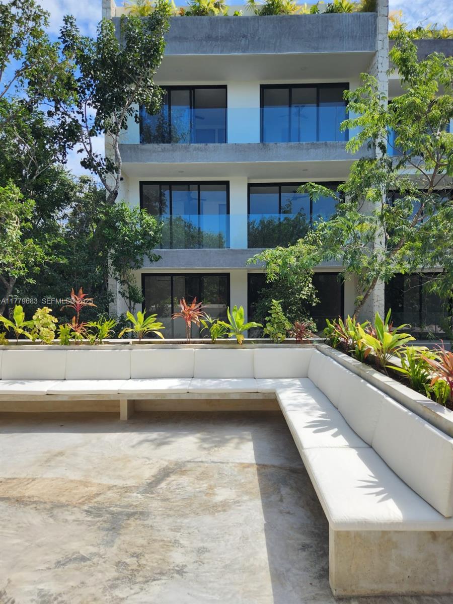 77760 Itzamna, Unit D101 undefined, FL 00000 - Photo 31 of 35 a view of house with swimming pool and a porch