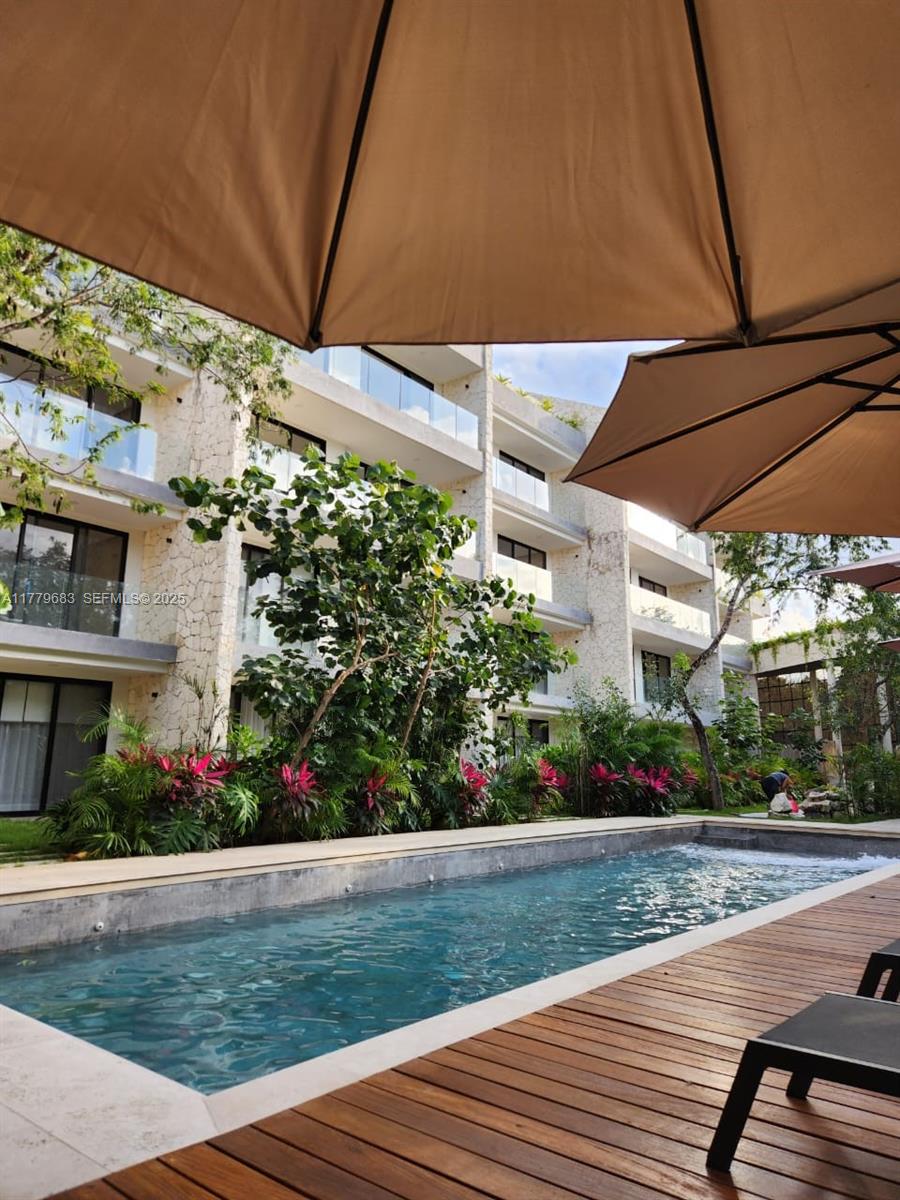 77760 Itzamna, Unit D101 undefined, FL 00000 - Photo 35 of 35 a view of a house with a yard