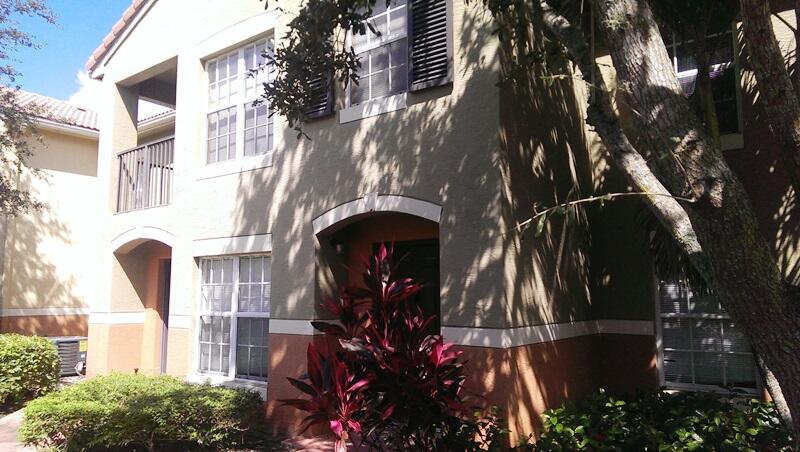 10276 Fox Trail Road South, Unit 111 West Palm Beach, FL 33411 - Photo 5 of 16 a view of a building with a tree