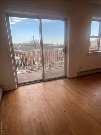 a view of an empty room with a balcony