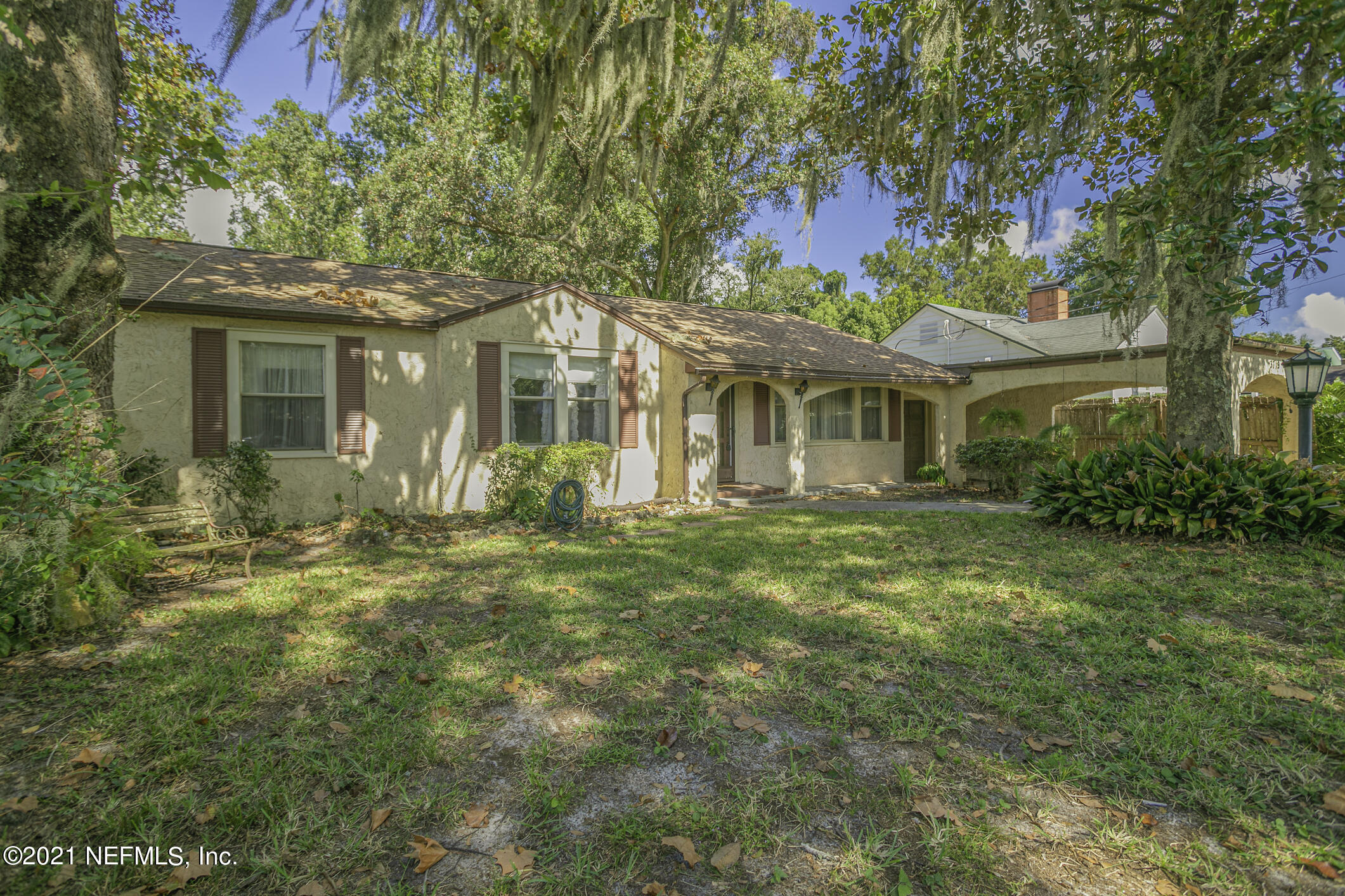 3719 Lilly Road North Jacksonville, FL 32207 - Photo 4 of 61 a front view of a house with a garden