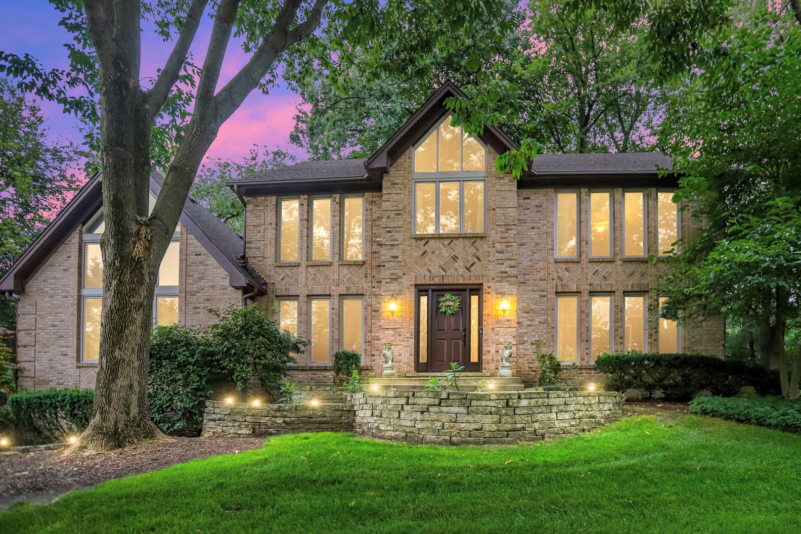 a front view of a house with a yard