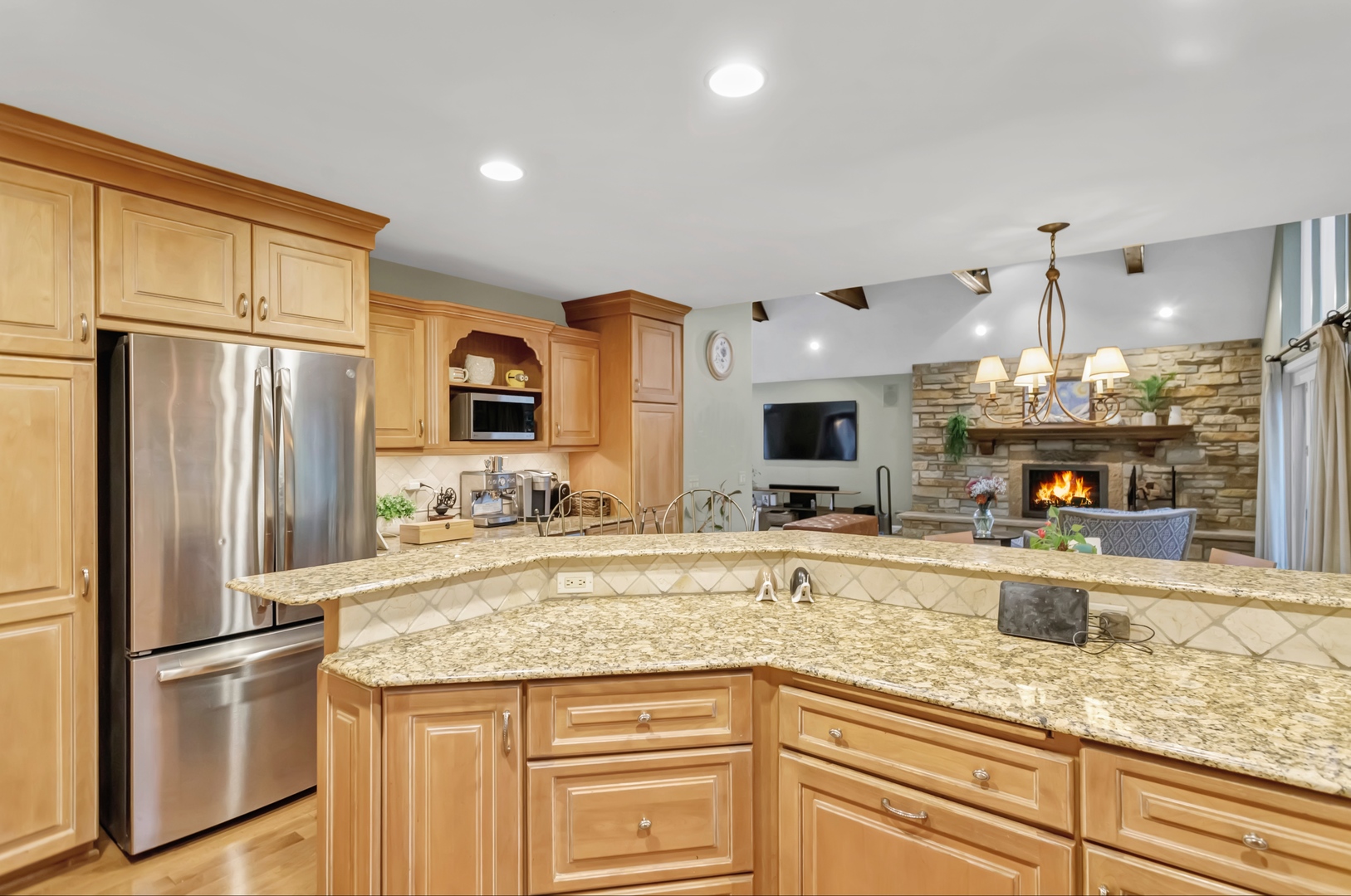 985 Chapel Court North Glen Ellyn, IL 60137 - Photo 18 of 46 a kitchen with granite countertop a sink stainless steel appliances and cabinets