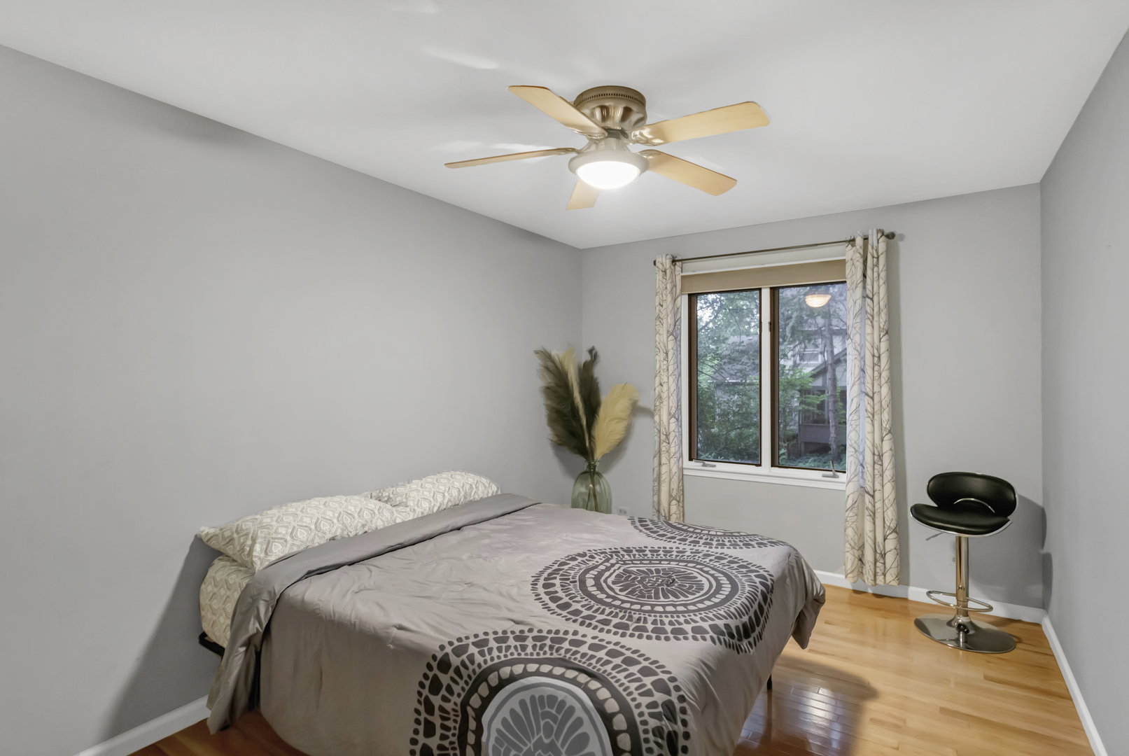 985 Chapel Court North Glen Ellyn, IL 60137 - Photo 30 of 46 a bedroom with a bed and a chandelier