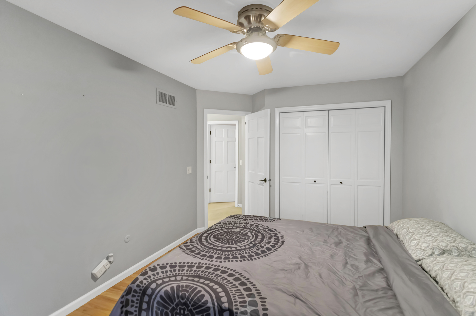 985 Chapel Court North Glen Ellyn, IL 60137 - Photo 31 of 46 a bedroom with a bed and a chandelier